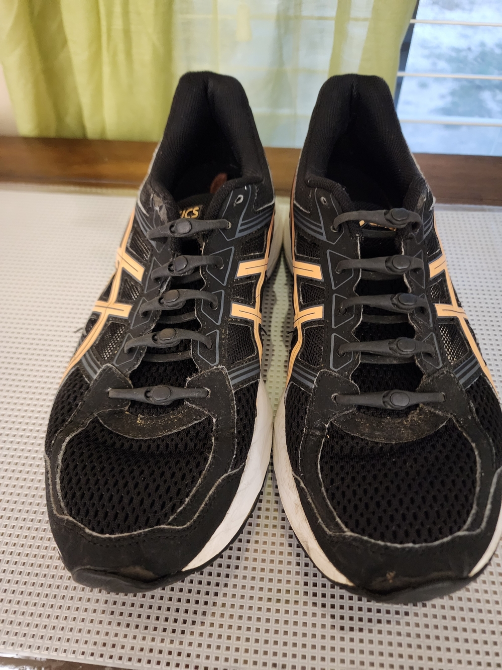 Woman's Black and peach-accented ASICS Gel-Contend 4 Size 9.5
